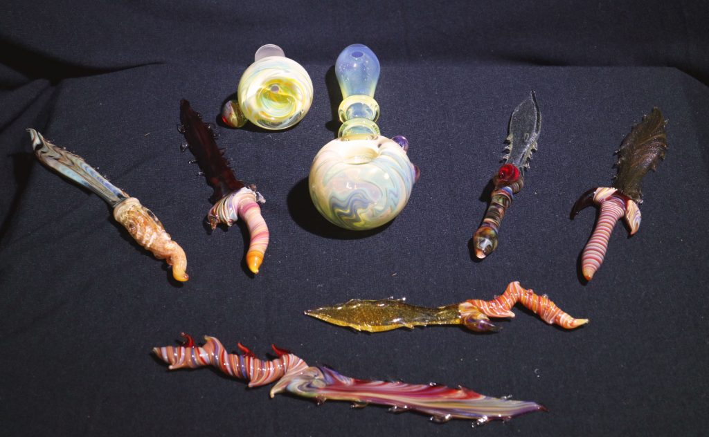 Glass dabber swords, pipes, and bowls by B-hold Glass